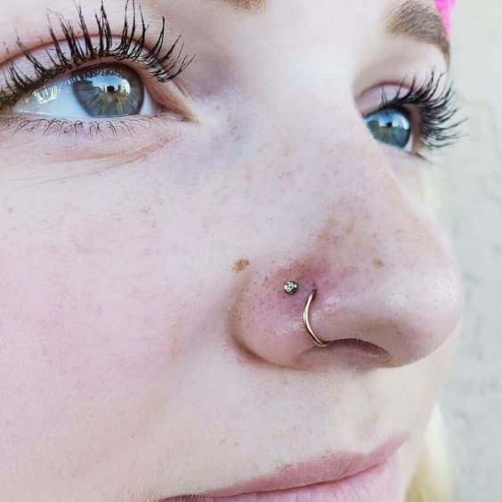 double nose piercing on opposite sides