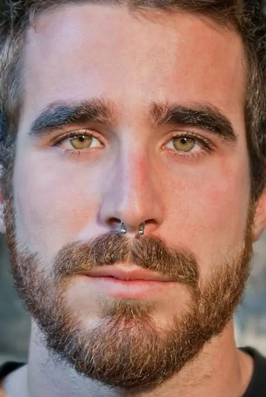 Cultural and Symbolic men with septum piercing