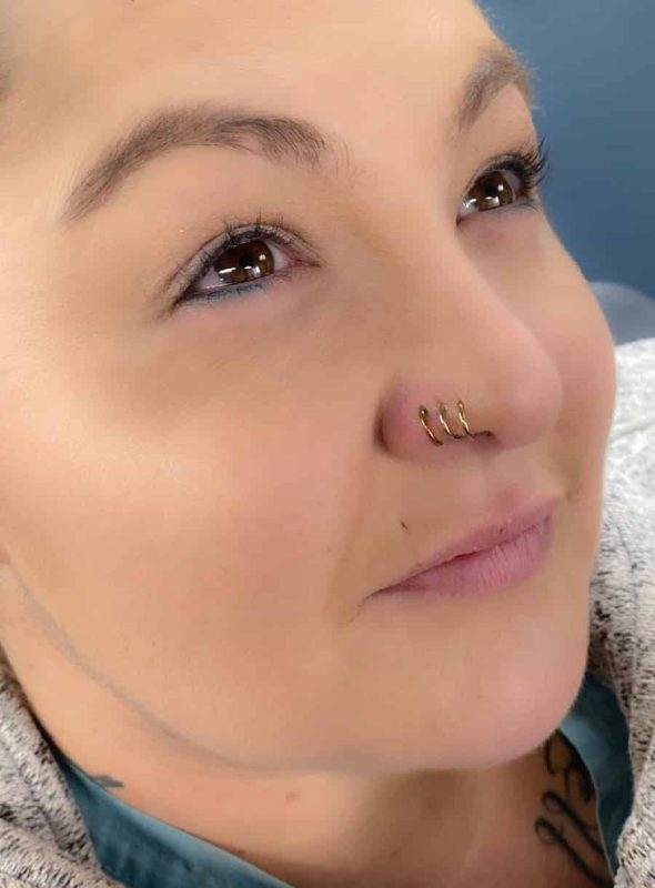 Triple Nose Piercing on one side